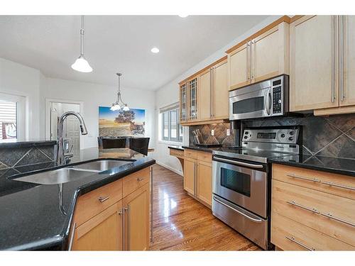 36 Ypres Way Sw, Calgary, AB - Indoor Photo Showing Kitchen With Double Sink