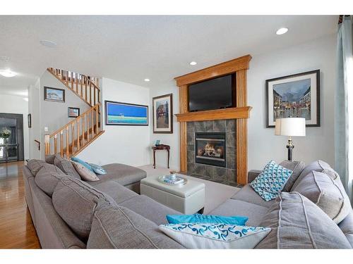 36 Ypres Way Sw, Calgary, AB - Indoor Photo Showing Living Room With Fireplace