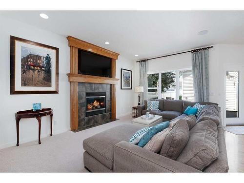 36 Ypres Way Sw, Calgary, AB - Indoor Photo Showing Living Room With Fireplace