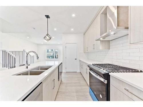 816 Midtown Drive Sw, Airdrie, AB - Indoor Photo Showing Kitchen With Double Sink With Upgraded Kitchen