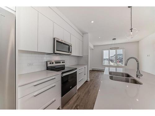 1405-60 Skyview Ranch Road Ne, Calgary, AB - Indoor Photo Showing Kitchen With Stainless Steel Kitchen With Double Sink With Upgraded Kitchen