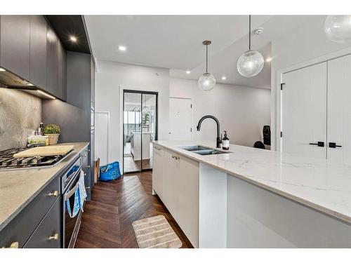 210-8505 Broadcast Avenue Sw, Calgary, AB - Indoor Photo Showing Kitchen With Double Sink With Upgraded Kitchen