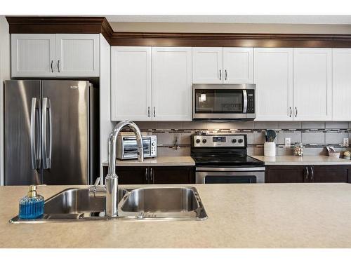 19 Cranford Close Se, Calgary, AB - Indoor Photo Showing Kitchen With Double Sink With Upgraded Kitchen