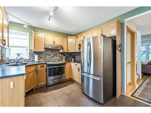 50 Hidden Ranch Circle Nw, Calgary, AB - Indoor Photo Showing Kitchen With Stainless Steel Kitchen With Double Sink