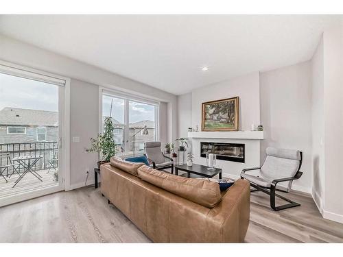 280 Sage Bluff Rise Nw, Calgary, AB - Indoor Photo Showing Living Room With Fireplace