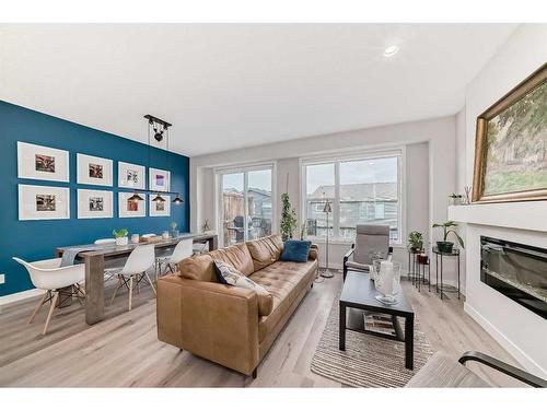 280 Sage Bluff Rise Nw, Calgary, AB - Indoor Photo Showing Living Room With Fireplace