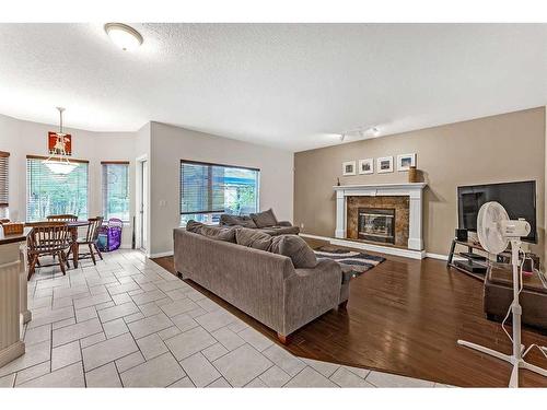 85 Royal Crest Terrace Nw, Calgary, AB - Indoor Photo Showing Living Room With Fireplace