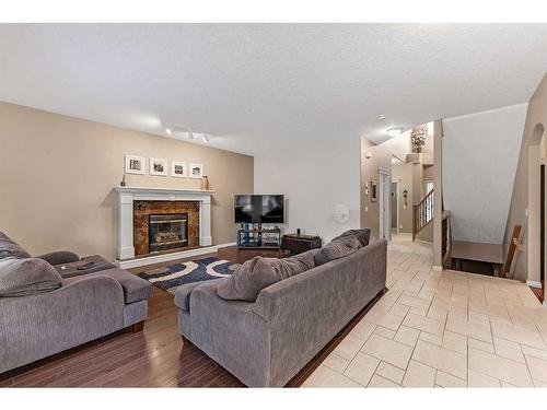 85 Royal Crest Terrace Nw, Calgary, AB - Indoor Photo Showing Living Room With Fireplace