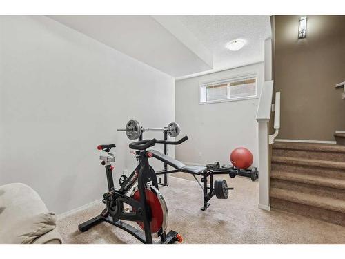 461 Cranford Drive Se, Calgary, AB - Indoor Photo Showing Gym Room