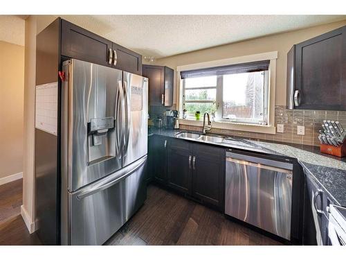 343 Covecreek Circle Ne, Calgary, AB - Indoor Photo Showing Kitchen With Stainless Steel Kitchen With Double Sink