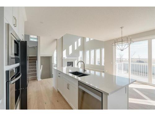 108 Cimarron Estates Drive, Okotoks, AB - Indoor Photo Showing Kitchen With Double Sink With Upgraded Kitchen