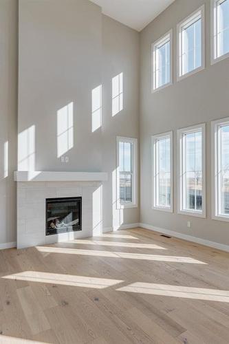 108 Cimarron Estates Drive, Okotoks, AB - Indoor Photo Showing Other Room With Fireplace