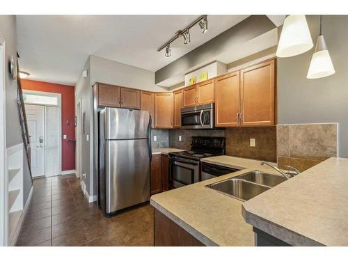 18-169 Rockyledge View Nw, Calgary, AB - Indoor Photo Showing Kitchen With Double Sink