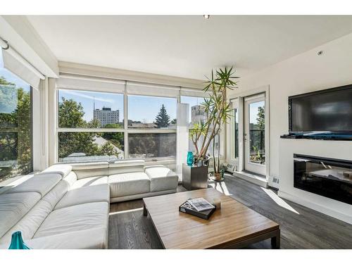 403-1730 5A Street Sw, Calgary, AB - Indoor Photo Showing Living Room With Fireplace