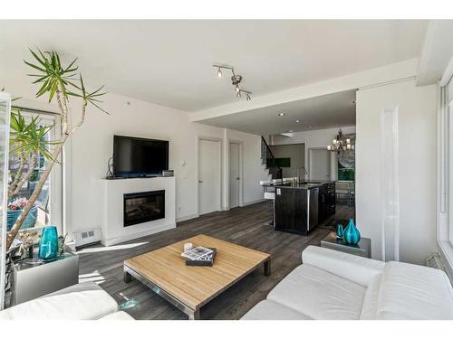 403-1730 5A Street Sw, Calgary, AB - Indoor Photo Showing Living Room With Fireplace