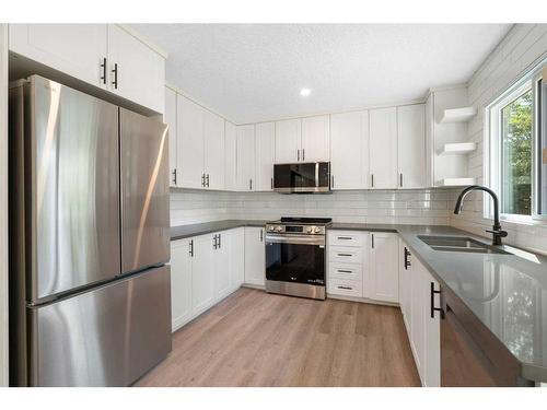 124 Woodborough Road Sw, Calgary, AB - Indoor Photo Showing Kitchen With Double Sink With Upgraded Kitchen