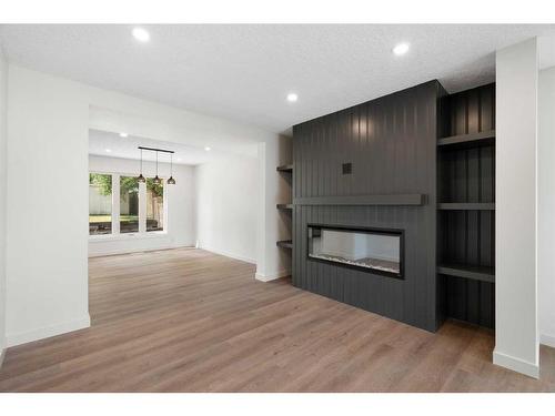 124 Woodborough Road Sw, Calgary, AB - Indoor Photo Showing Living Room With Fireplace