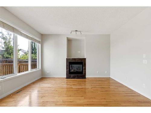 140 Bridlemeadows Common Sw, Calgary, AB - Indoor Photo Showing Living Room With Fireplace