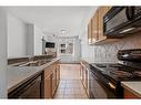 437-910 Centre Avenue Ne, Calgary, AB  - Indoor Photo Showing Kitchen With Double Sink 