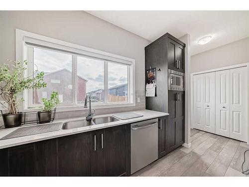 213 Livingston View Nw, Calgary, AB - Indoor Photo Showing Kitchen With Double Sink