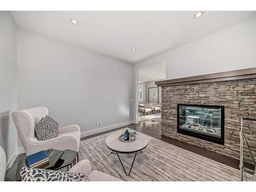 22 Timberline Place Sw, Calgary, AB - Indoor Photo Showing Living Room With Fireplace