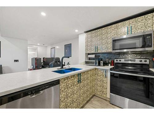 8 Seton Terrace Se, Calgary, AB - Indoor Photo Showing Kitchen With Stainless Steel Kitchen With Double Sink