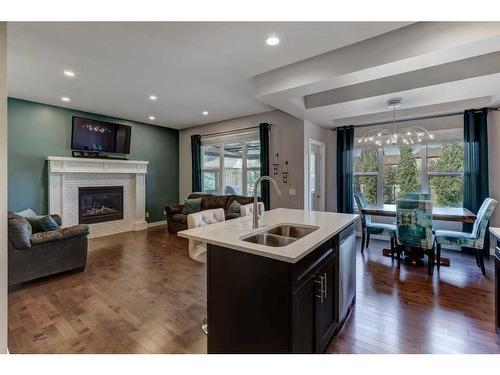 88 Cooperstown Place Sw, Airdrie, AB - Indoor Photo Showing Living Room With Fireplace