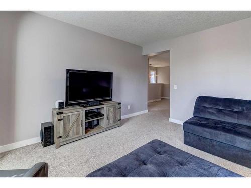 88 Cooperstown Place Sw, Airdrie, AB - Indoor Photo Showing Living Room