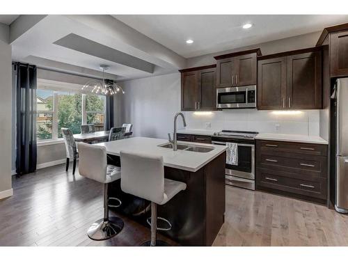 88 Cooperstown Place Sw, Airdrie, AB - Indoor Photo Showing Kitchen With Stainless Steel Kitchen With Double Sink With Upgraded Kitchen