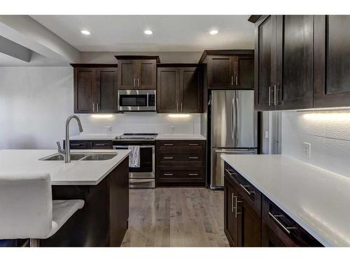 88 Cooperstown Place Sw, Airdrie, AB - Indoor Photo Showing Kitchen With Stainless Steel Kitchen With Double Sink With Upgraded Kitchen