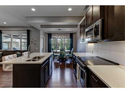 88 Cooperstown Place Sw, Airdrie, AB - Indoor Photo Showing Kitchen With Double Sink With Upgraded Kitchen