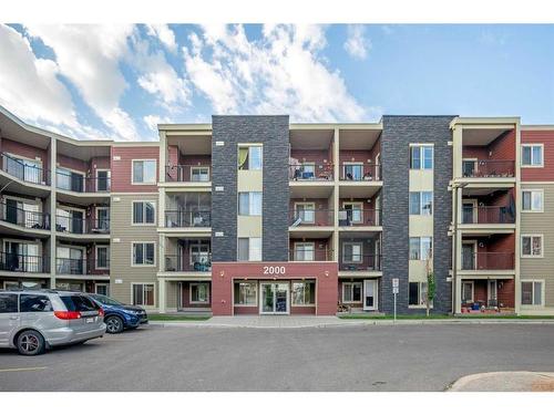 404-15 Saddlestone Way Ne, Calgary, AB - Outdoor With Balcony With Facade