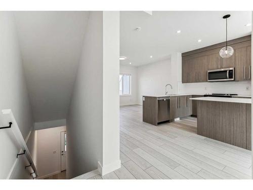 #305-280 Chelsea Road, Chestermere, AB - Indoor Photo Showing Kitchen With Upgraded Kitchen