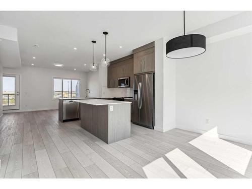 #305-280 Chelsea Road, Chestermere, AB - Indoor Photo Showing Kitchen With Stainless Steel Kitchen With Upgraded Kitchen