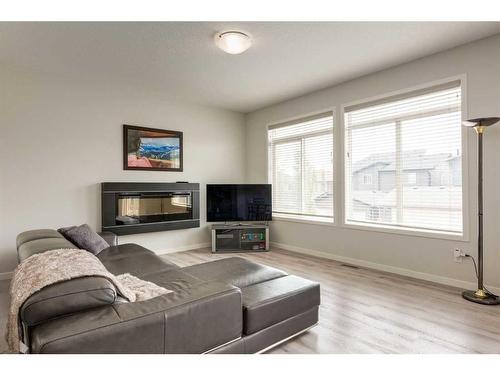 33 Sage Bluff Close Nw, Calgary, AB - Indoor Photo Showing Living Room With Fireplace