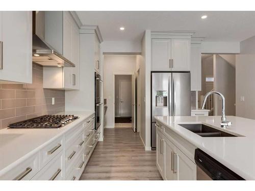 33 Sage Bluff Close Nw, Calgary, AB - Indoor Photo Showing Kitchen With Stainless Steel Kitchen With Double Sink With Upgraded Kitchen