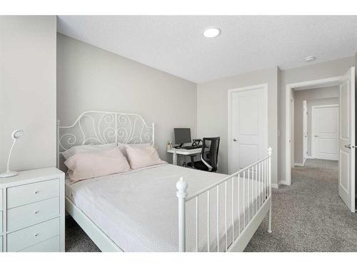 6 Magnolia Manor Se, Calgary, AB - Indoor Photo Showing Bedroom