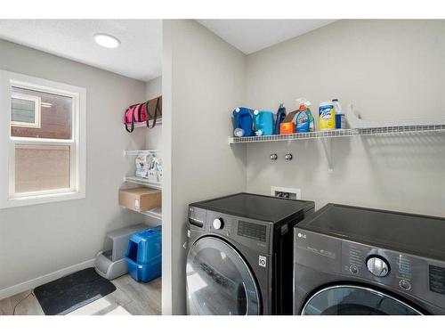 6 Magnolia Manor Se, Calgary, AB - Indoor Photo Showing Laundry Room