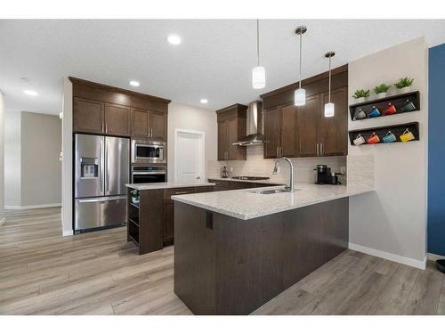 6 Magnolia Manor Se, Calgary, AB - Indoor Photo Showing Kitchen With Upgraded Kitchen