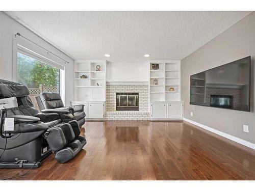 9 Strathdale Close Sw, Calgary, AB - Indoor Photo Showing Living Room With Fireplace