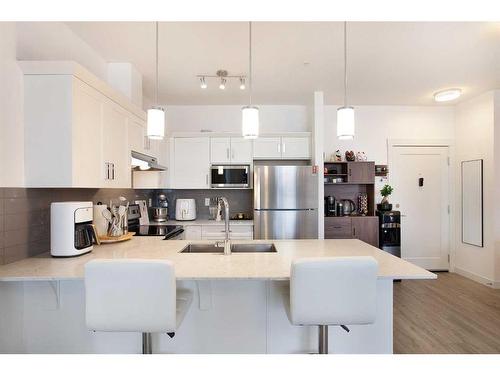 2305-522 Cranford Drive Se, Calgary, AB - Indoor Photo Showing Kitchen With Stainless Steel Kitchen With Double Sink With Upgraded Kitchen