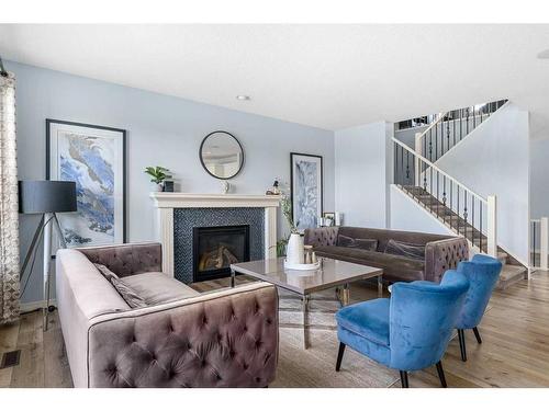 225 Auburn Glen Manor Se, Calgary, AB - Indoor Photo Showing Living Room With Fireplace