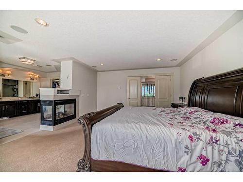 4 Rockcliff Point Nw, Calgary, AB - Indoor Photo Showing Bedroom