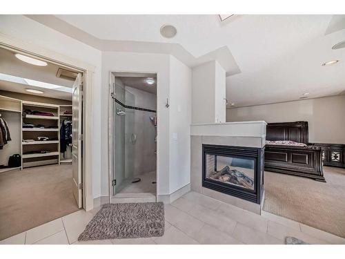 4 Rockcliff Point Nw, Calgary, AB - Indoor With Fireplace