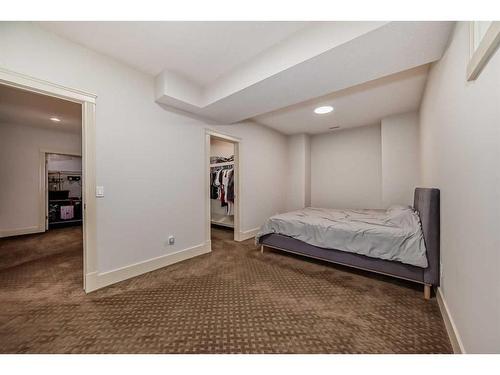 4 Rockcliff Point Nw, Calgary, AB - Indoor Photo Showing Bedroom