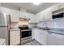 .-2307 Sienna Park Green Sw, Calgary, AB  - Indoor Photo Showing Kitchen With Stainless Steel Kitchen With Double Sink 