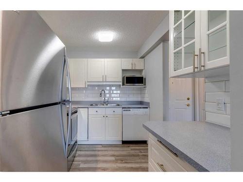 .-2307 Sienna Park Green Sw, Calgary, AB - Indoor Photo Showing Kitchen With Stainless Steel Kitchen With Double Sink