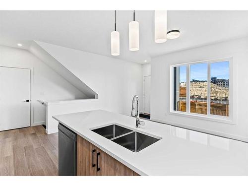 14-2117 81 Street Sw, Calgary, AB - Indoor Photo Showing Kitchen With Double Sink