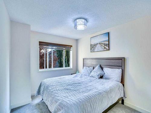 256 Cove Drive, Chestermere, AB - Indoor Photo Showing Bedroom