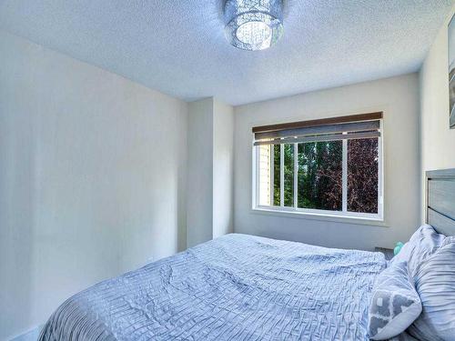 256 Cove Drive, Chestermere, AB - Indoor Photo Showing Bedroom